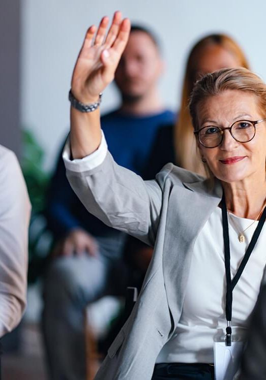 confident businesswoman raising hand confident businesswoman raising hand