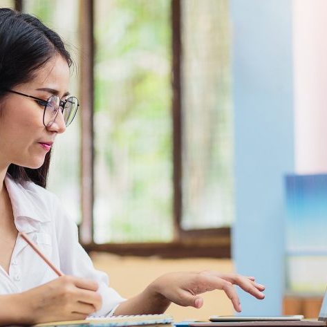 Photo of woman taking notes for Learning Forward Website